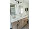 Modern bathroom with double vanity, stylish mirrors, and contemporary fixtures at 793 Round Tree Ct, Lawrenceville, GA 30045