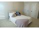Bright bedroom featuring plush carpeting, neutral walls, and a comfortable bed with decorative throw pillows at 793 Round Tree Ct, Lawrenceville, GA 30045