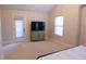 Bedroom offering plenty of natural light from the large window and convenient outdoor access through the glass door at 793 Round Tree Ct, Lawrenceville, GA 30045