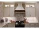 The kitchen features white cabinets, marble countertops, subway tile backsplash, and stainless steel appliances at 793 Round Tree Ct, Lawrenceville, GA 30045