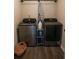 Modern laundry room featuring front load washer and dryer at 793 Round Tree Ct, Lawrenceville, GA 30045