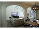 Open living room with high ceilings, decorative chandelier, and large windows for lots of natural light at 793 Round Tree Ct, Lawrenceville, GA 30045