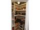 The walk-in pantry has custom shelves and drawers for optimal storage and organization at 793 Round Tree Ct, Lawrenceville, GA 30045