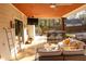 Inviting covered patio offering an outdoor bar, comfortable seating, and stylish decor for entertainment at 793 Round Tree Ct, Lawrenceville, GA 30045