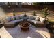 Outdoor seating area featuring a cozy fire pit and comfortable, cushioned furniture for relaxation at 793 Round Tree Ct, Lawrenceville, GA 30045