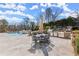 Expansive backyard with a luxurious pool, outdoor kitchen, dining area, and inviting spaces for relaxation and entertainment at 4100 Thunderbird Dr, Marietta, GA 30067
