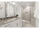 Elegant bathroom featuring a glass shower, vanity, and granite countertop, all creating a luxurious feel at 4100 Thunderbird Dr, Marietta, GA 30067