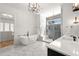 Luxurious bathroom with soaking tub, glass shower, and elegant marble flooring at 4100 Thunderbird Dr, Marietta, GA 30067