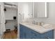 Bathroom features white countertop, blue vanity, and open closet at 4100 Thunderbird Dr, Marietta, GA 30067