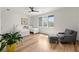 Charming bedroom with hardwood floors, comfortable seating, and two twin beds for guests or children at 4100 Thunderbird Dr, Marietta, GA 30067