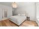 Elegant primary bedroom with hardwood floors and a chandelier at 4100 Thunderbird Dr, Marietta, GA 30067