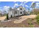 Beautifully landscaped two-story home featuring manicured grounds, modern design elements, and elegant curb appeal at 4100 Thunderbird Dr, Marietta, GA 30067