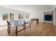 Large game room with hardwood floors, ping pong table, foosball table, and backyard access at 4100 Thunderbird Dr, Marietta, GA 30067