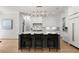 Modern kitchen featuring a large island, pendant lighting, and sleek white cabinetry at 4100 Thunderbird Dr, Marietta, GA 30067
