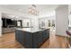 Stylish kitchen island with seating, bright countertops, and an open layout to the living area at 4100 Thunderbird Dr, Marietta, GA 30067