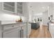 Stylish kitchen with a view of the island, white cabinetry, and open access to the outdoor area at 4100 Thunderbird Dr, Marietta, GA 30067