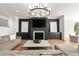 Contemporary living room with a sleek fireplace, built-in shelving, and comfortable seating for stylish relaxation at 4100 Thunderbird Dr, Marietta, GA 30067