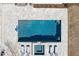 Aerial view of a pristine pool with a tanning ledge, lounge chairs, and impeccable tile work and coping at 4100 Thunderbird Dr, Marietta, GA 30067
