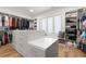Large walk-in closet with custom shelving, drawers, and ample hanging space at 4100 Thunderbird Dr, Marietta, GA 30067