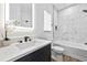 Stylish bathroom with a marble-look tiled shower and a modern vanity with an illuminated mirror at 6010 Canaan Woods Dr, South Fulton, GA 30331