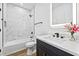 Stylish bathroom featuring marble-look tile in the shower, and modern fixtures at 6010 Canaan Woods Dr, South Fulton, GA 30331