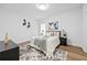 Cozy bedroom featuring a plush rug, wood-look floors, and neutral decor at 6010 Canaan Woods Dr, South Fulton, GA 30331
