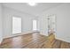 Bright, airy bedroom with wood-look floors and a connected bathroom at 6010 Canaan Woods Dr, South Fulton, GA 30331