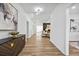 Welcoming entryway showcasing modern decor, wood floors, and an open floor plan at 6010 Canaan Woods Dr, South Fulton, GA 30331