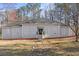 Charming single-story home with a well-manicured lawn and inviting front entrance at 6010 Canaan Woods Dr, South Fulton, GA 30331