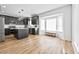 Spacious open kitchen with black cabinets, an island, stainless steel appliances, and a cozy breakfast nook at 6010 Canaan Woods Dr, South Fulton, GA 30331