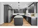 Modern kitchen featuring dark cabinetry, a central island, stainless steel appliances, and stylish pendant lighting at 6010 Canaan Woods Dr, South Fulton, GA 30331