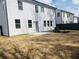 View of the home's backyard, showcasing a concrete patio and privacy fence at 793 River Gardens Dr, Atlanta, GA 30354