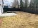 Spacious backyard featuring a privacy fence and concrete patio area at 793 River Gardens Dr, Atlanta, GA 30354