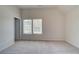 Bright bedroom featuring neutral carpet, and a double window for natural light at 793 River Gardens Dr, Atlanta, GA 30354