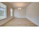 Spacious dining room with light wood floors and neutral walls, bathed in sunlight at 793 River Gardens Dr, Atlanta, GA 30354