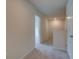 Upstairs hallway with gray carpet leading to bedrooms and overlooking the staircase at 793 River Gardens Dr, Atlanta, GA 30354