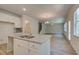 Bright kitchen with granite countertops, stainless faucet and fixtures, island and view to a living room at 793 River Gardens Dr, Atlanta, GA 30354