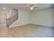 Bright living room with light wood flooring, staircase and neutral color palette at 793 River Gardens Dr, Atlanta, GA 30354