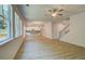 Open concept living room with wood floors, large windows and a view to the kitchen at 793 River Gardens Dr, Atlanta, GA 30354