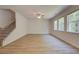 Spacious living room featuring wood floors, large windows, and a ceiling fan at 793 River Gardens Dr, Atlanta, GA 30354