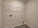 This storage room includes vinyl flooring and a wire shelf for organization at 793 River Gardens Dr, Atlanta, GA 30354
