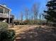 Expansive backyard with lush green grass and mature trees at 8008 Revere Dr, Mcdonough, GA 30252