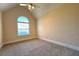 Bedroom features a vaulted ceiling, a ceiling fan, and a window at 8008 Revere Dr, Mcdonough, GA 30252