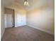 Neutral bedroom featuring a vaulted ceiling, ceiling fan, and a double door closet at 8008 Revere Dr, Mcdonough, GA 30252