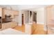 Open kitchen featuring wood cabinets, a center island, stainless appliances, and hardwood floors at 8008 Revere Dr, Mcdonough, GA 30252