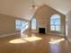 Bright, open living room with vaulted ceiling, fireplace, and hardwood floors at 8008 Revere Dr, Mcdonough, GA 30252
