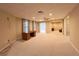 Home office featuring carpeted floors and built-in desk with adjacent rooms at 8008 Revere Dr, Mcdonough, GA 30252