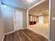 Spacious home office featuring hardwood floors, an adjacent room and a desk at 8008 Revere Dr, Mcdonough, GA 30252