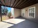 Covered patio with ample space for outdoor seating and entertaining at 8008 Revere Dr, Mcdonough, GA 30252