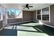 Enclosed porch featuring a ceiling fan and views of the outdoors through screened windows at 8008 Revere Dr, Mcdonough, GA 30252